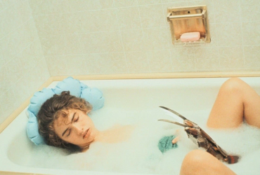 When the camera switches to the reverse view, underwater, it's a fulsome stunt woman.