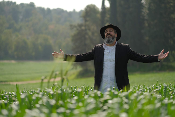A rabbi who's out standing in his field.