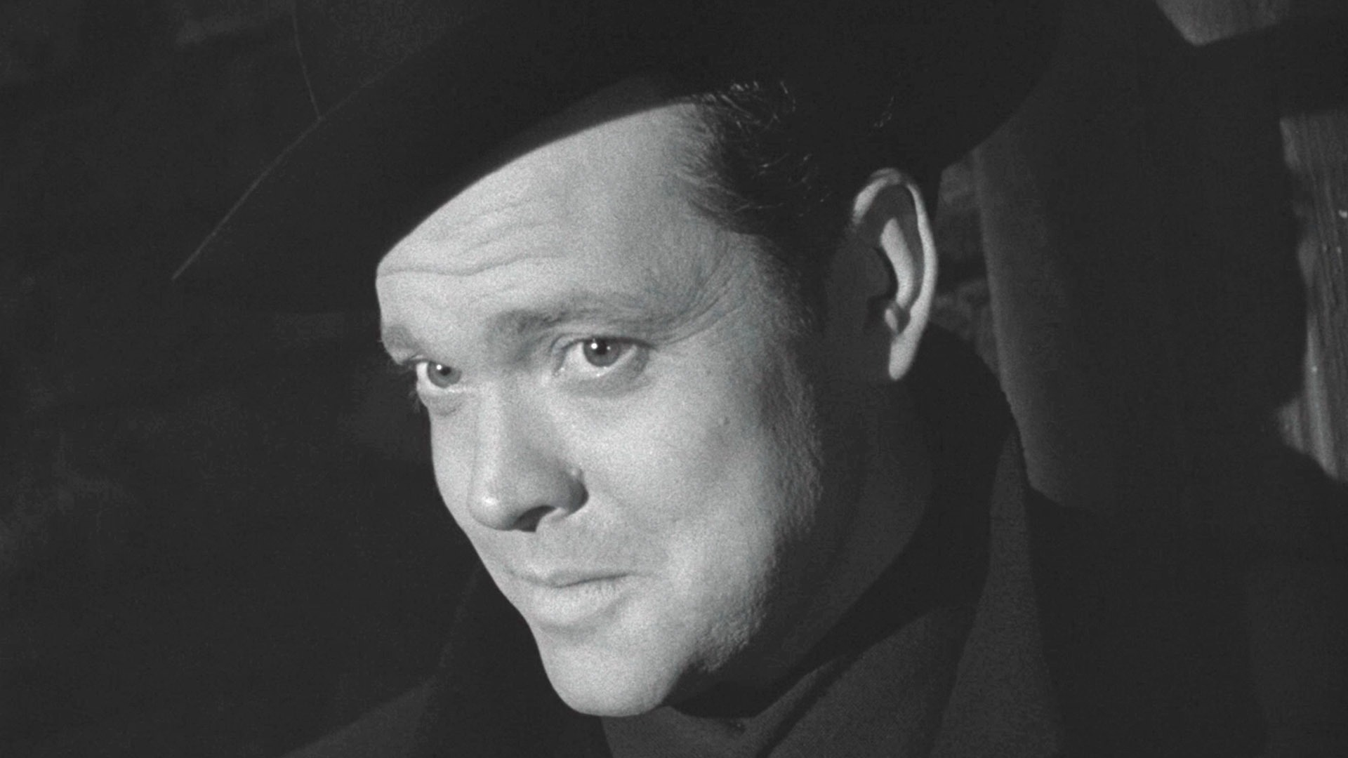 Orson Welles, smirking.