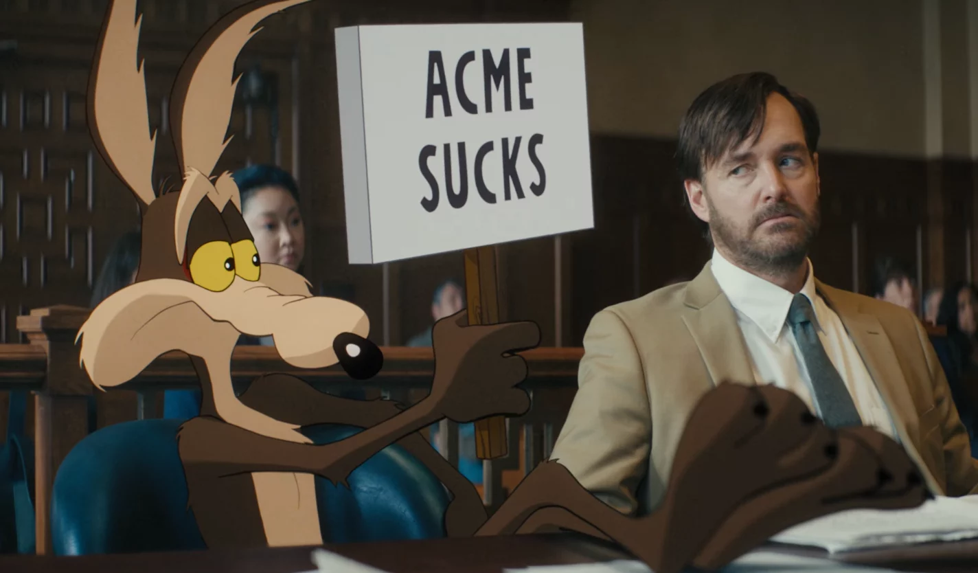 Coyote holding up sign "Acme Sucks", while lawyer gives sideye.
