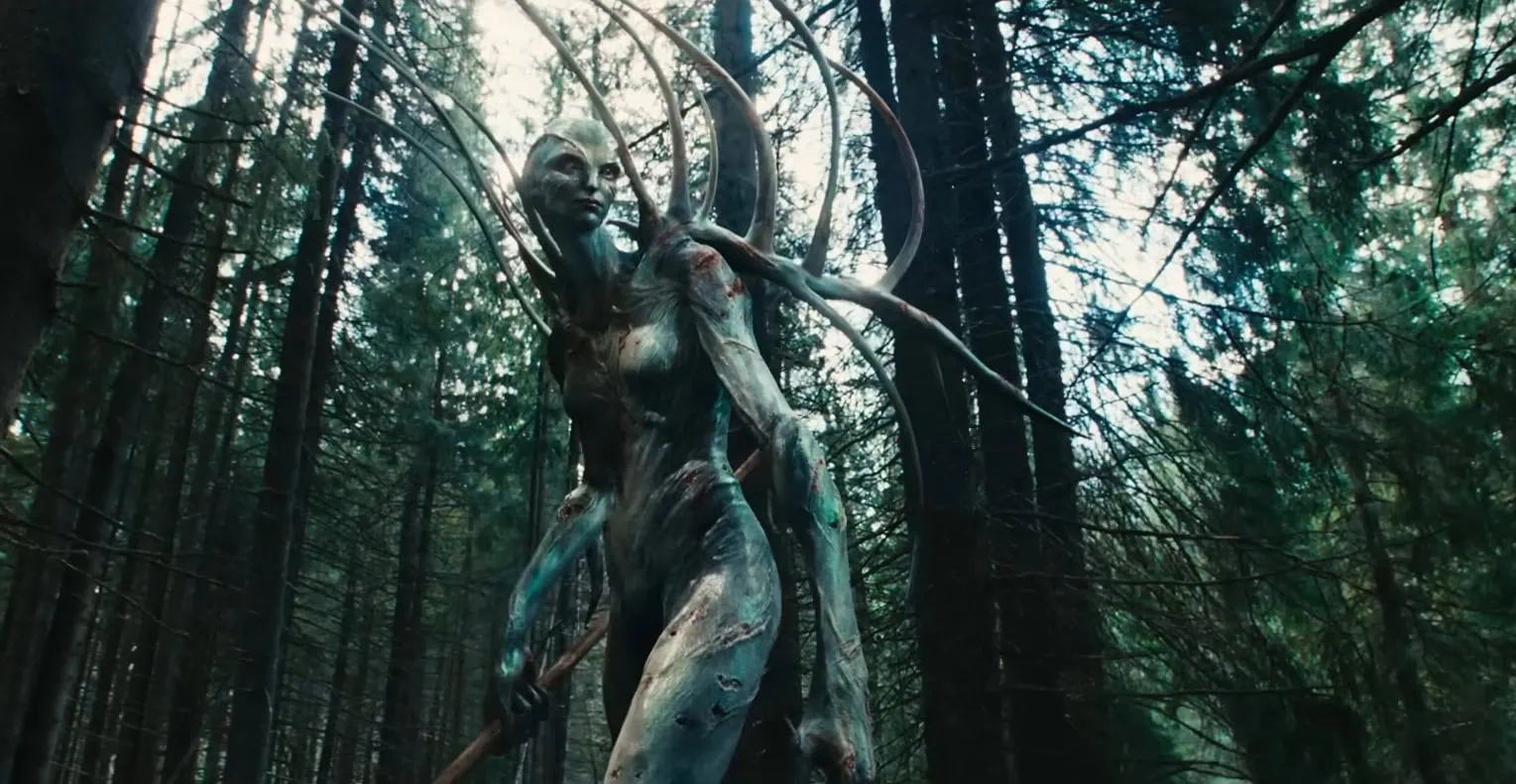 Large alien female with antlers.