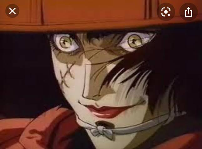 A woman with a scar on her face, with crazy eyes.